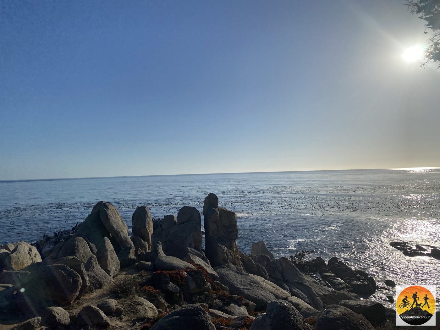 Weathered rock spires at Pescadero Point, known as the Ghost Trees stretch of 17 Mile Drive, with afternoon sun silvering the ocean