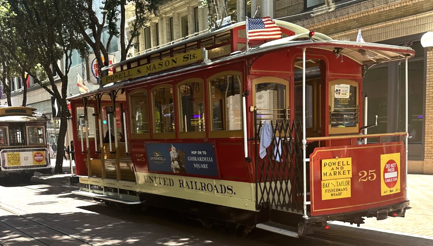A red Powell and Mason cable car at the Powell Street turnaround, San Francisco